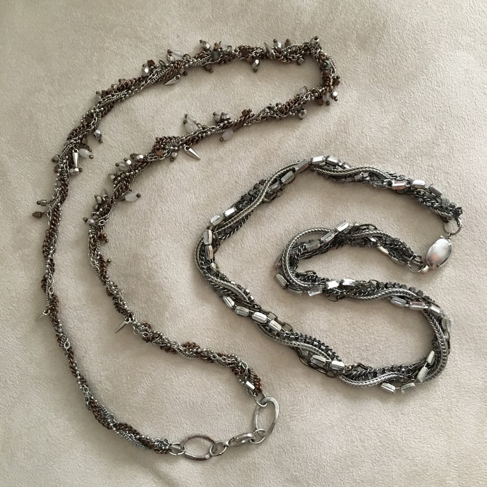 Pair of silver tone twisted beaded necklaces